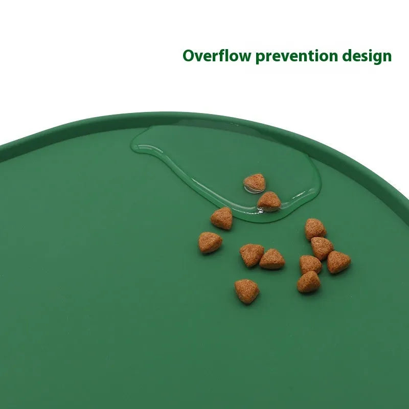 Silicone cat feeding placemat in beige colour, shown under food and water bowls on a kitchen floor.