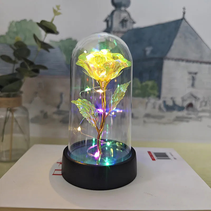 Glass cover small night lamp with plastic flowers in 15cm tall design with black base