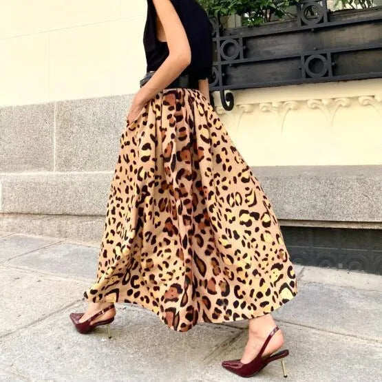 Brown leopard print women's A-line long skirt on hanger showing full length and animal pattern design