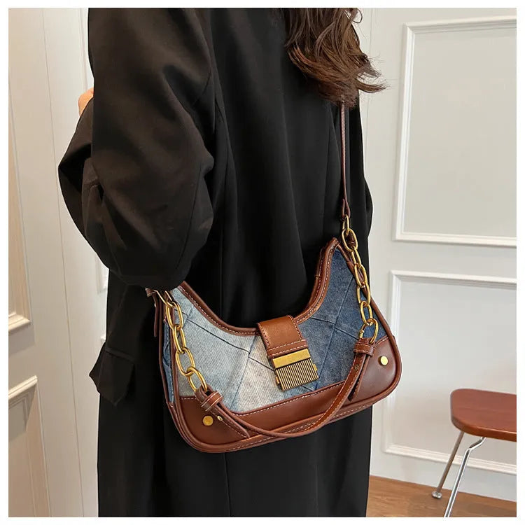 Brown denim women's shoulder bag with chain straps and bucket design showing phone compartment