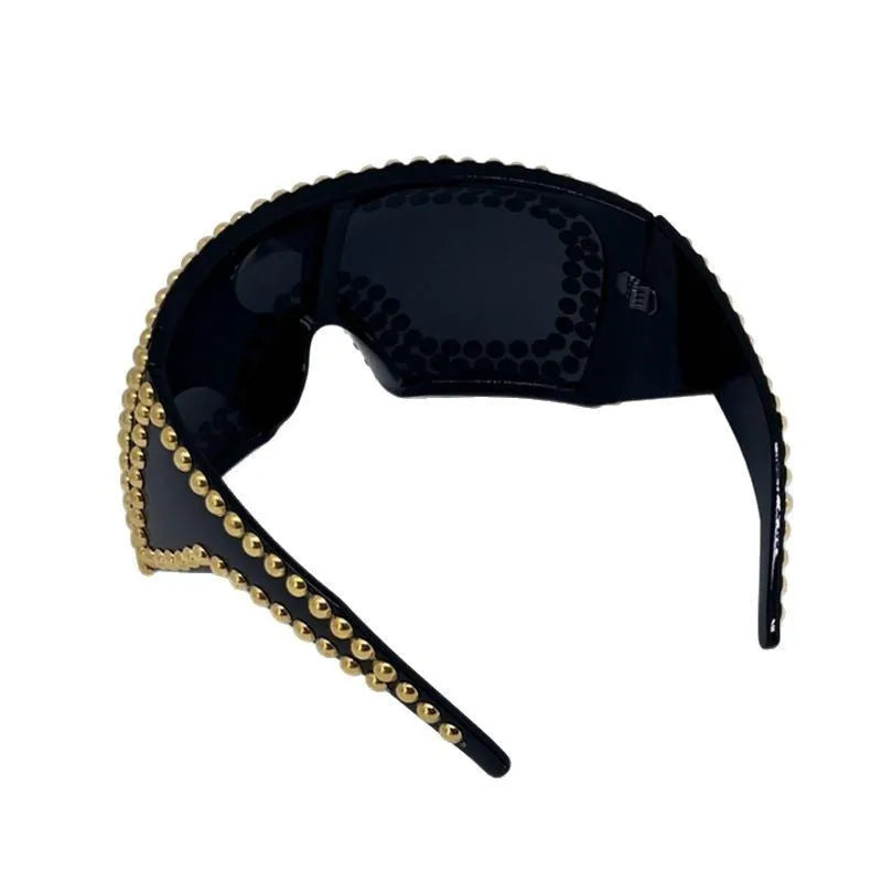 Men's punk sunglasses with large square frame and rivet detailing in silver colour