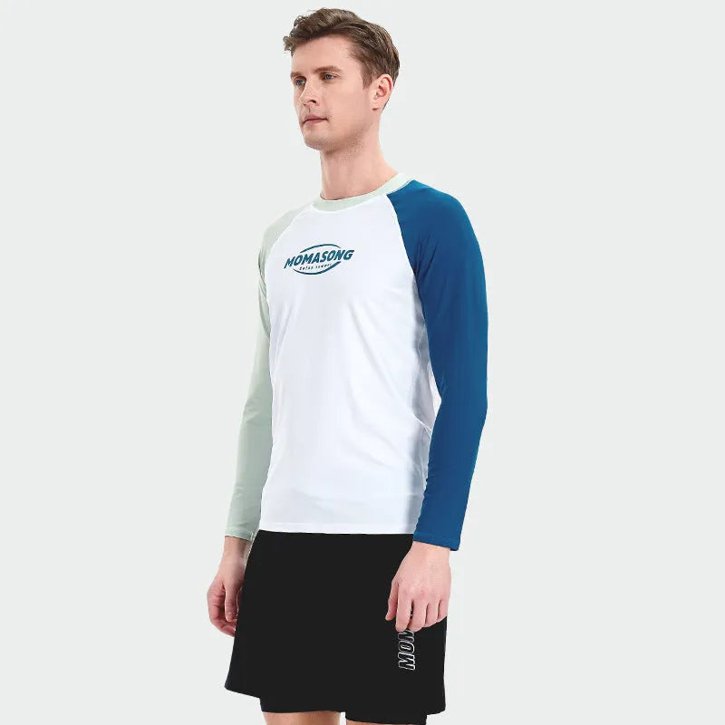 Man wearing a white long-sleeved swim top and matching swim trunks set for beach or pool.