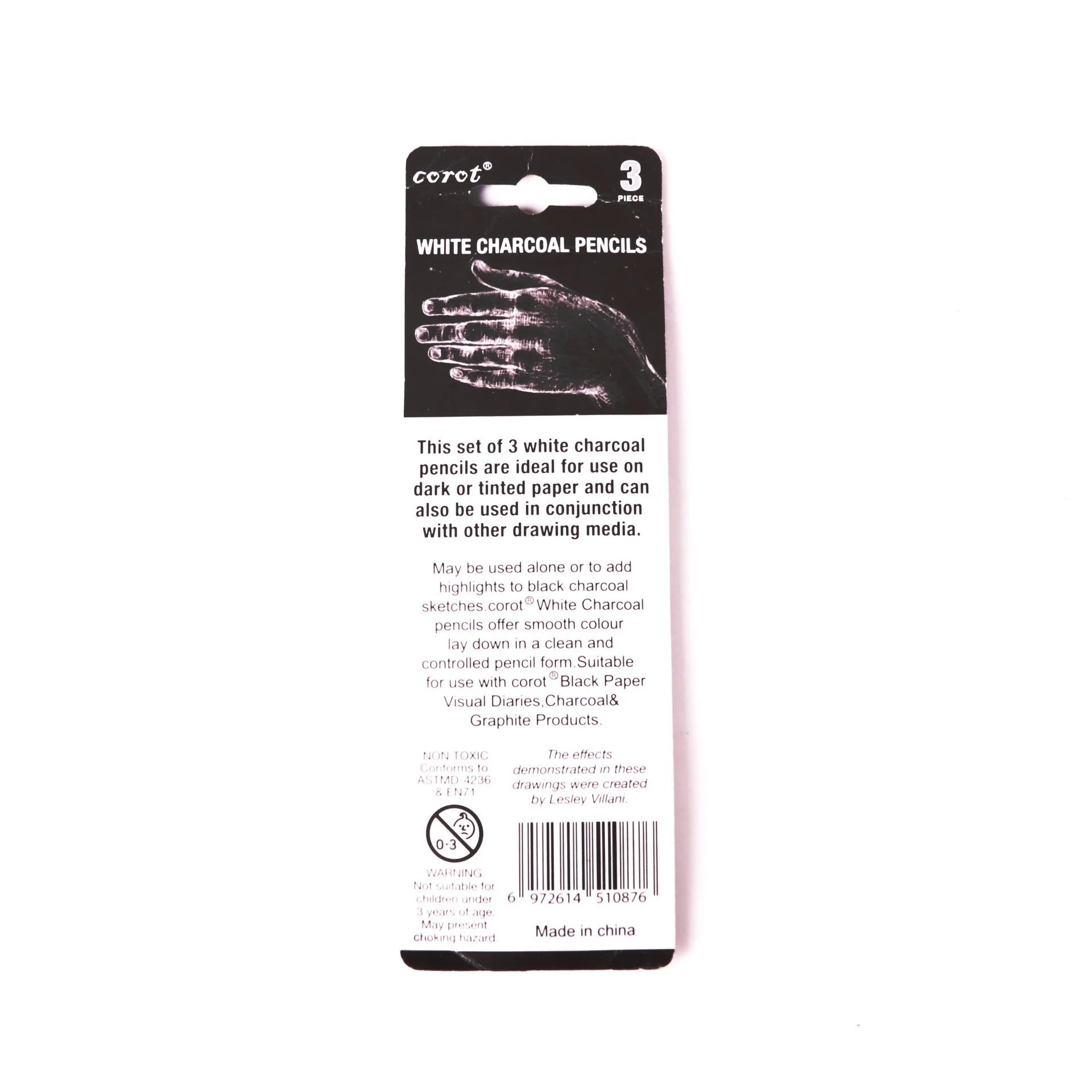 Set of three white charcoal pencils with wooden barrels for highlighting and sketching