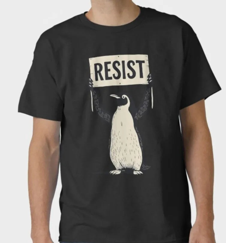 Straight cut loose fit cotton T-shirt in black, green, or white with short sleeves and round neck.