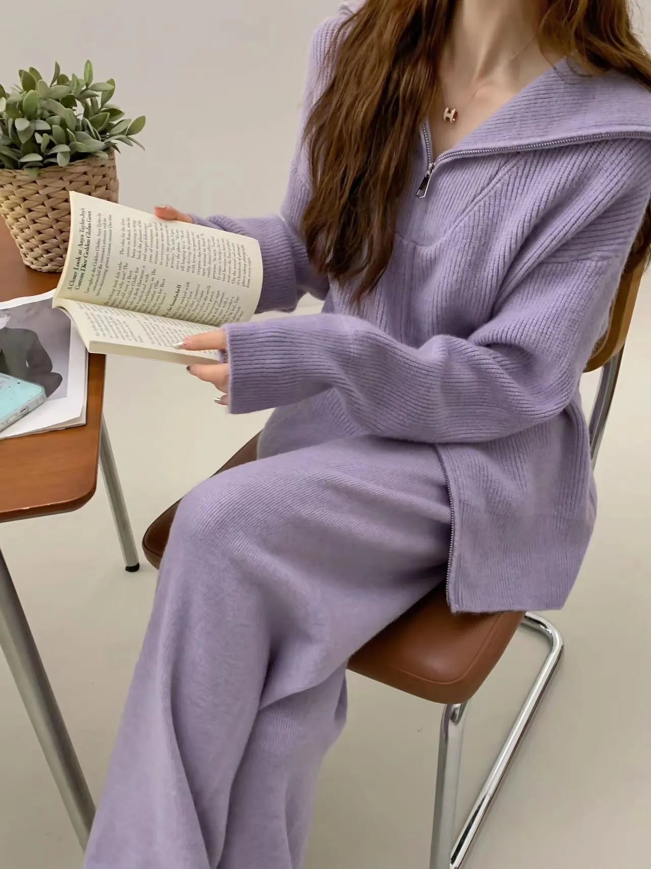 Solid colour knitted zip-front cardigan and wide-leg trousers two-piece set displayed in beige.