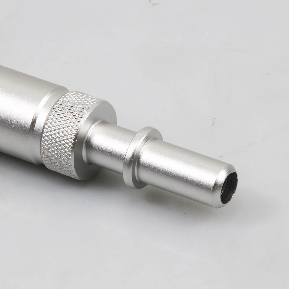 Silver metal VAS6262-9 transmission refueling joint tool on a workshop bench