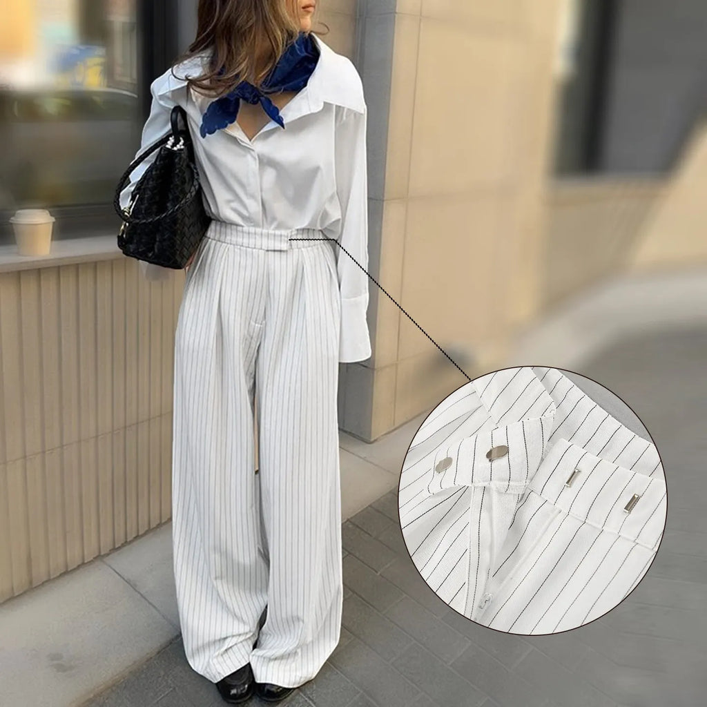 White striped wide-leg loose fit women's trousers with a zip fastening on a mannequin