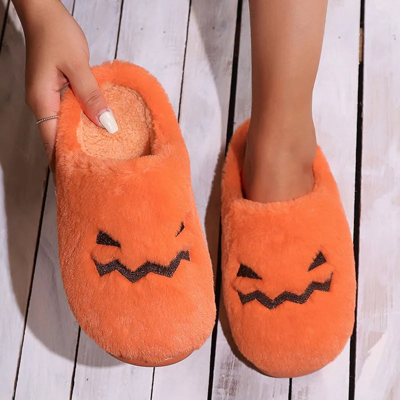 Orange coral velvet Halloween pumpkin-shaped slippers with a flat non-slip PVC sole and plush lining.