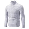 Man wearing a beige slim-fit chenille turtleneck sweater with a twist stitch texture.