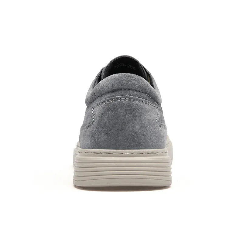 Men's grey casual skate shoes with pigskin upper and rubber sole, shown with front lace-up design and round toe