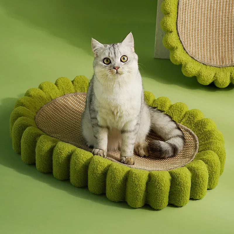 Green oval-shaped cat scratch pad bowl with sisal scratching surface, functioning as a cat bed.