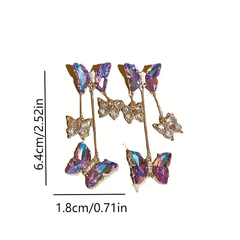 Blue purple butterfly earrings with silver needle crystal flowers and tassel detailing on alloy base