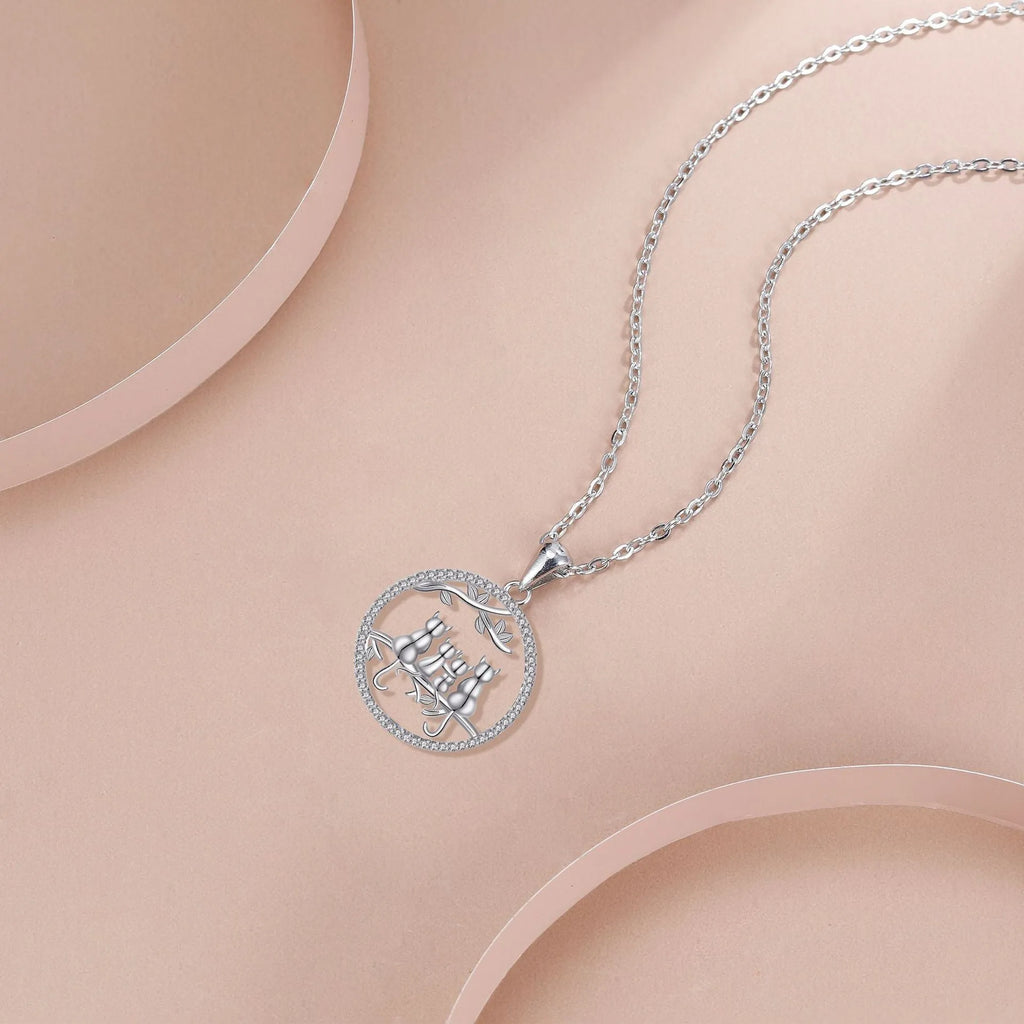 Copper necklace with four kitten pendant design on cross chain style