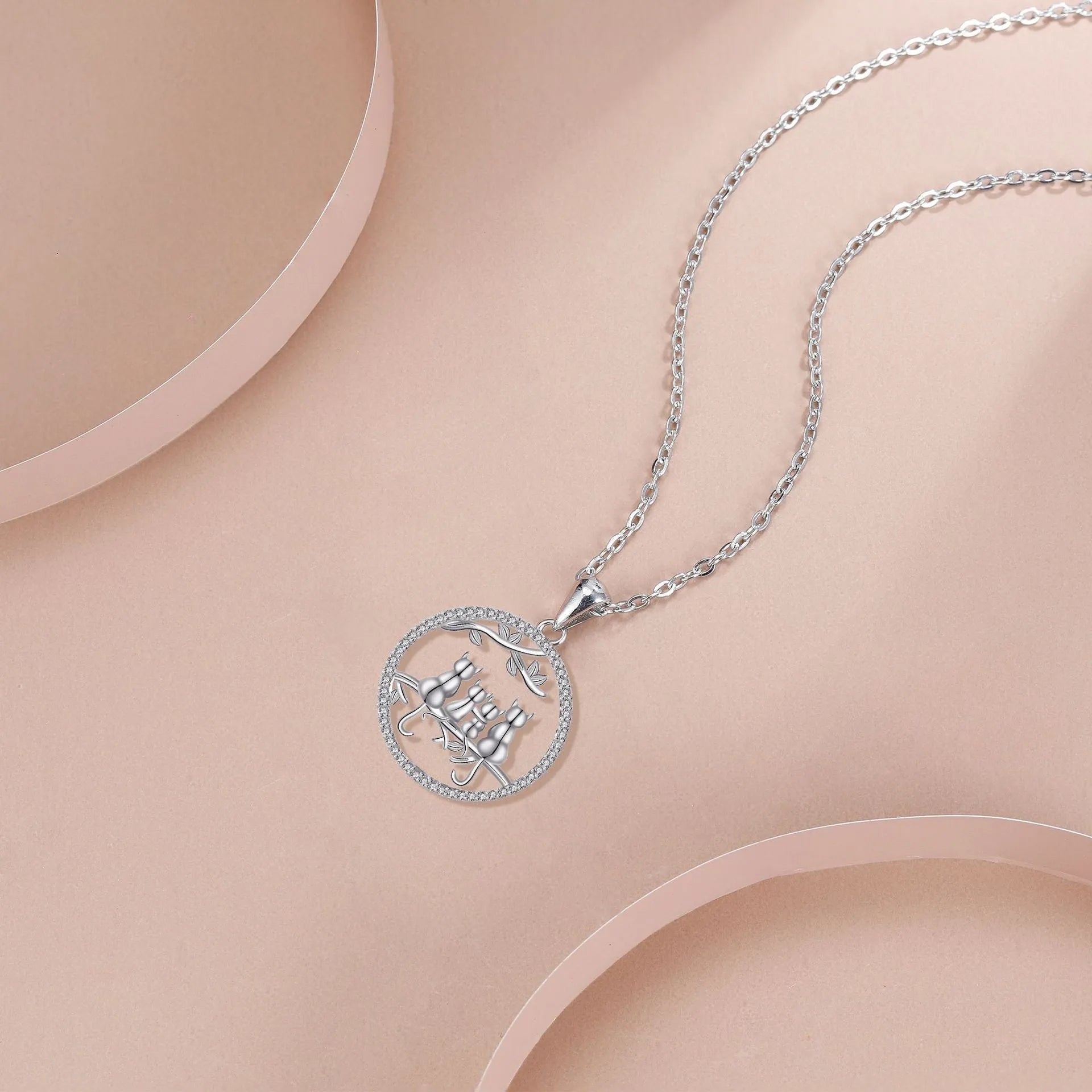 Copper necklace with four kitten pendant design on cross chain style