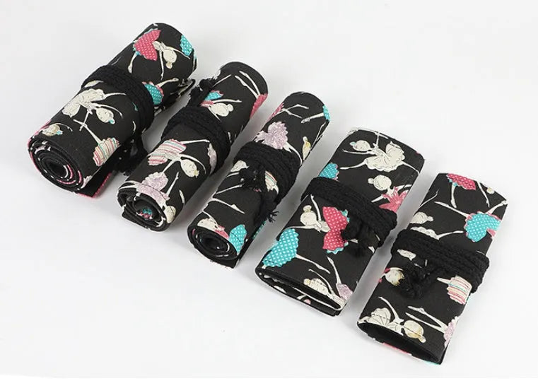Square canvas rolling pencil case with ballet girl print, unfurled to show multiple pencil slots.