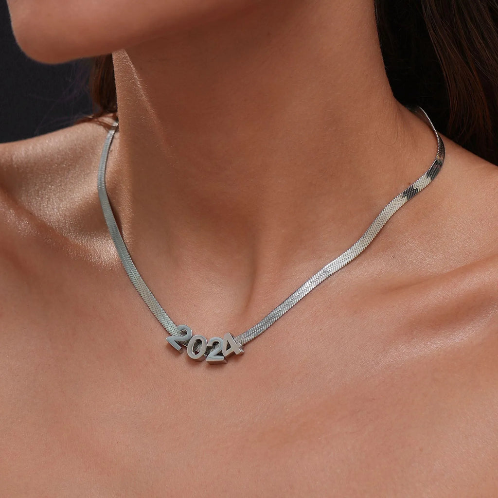 Gold electroplated titanium steel necklace with letter pendant on matching chain