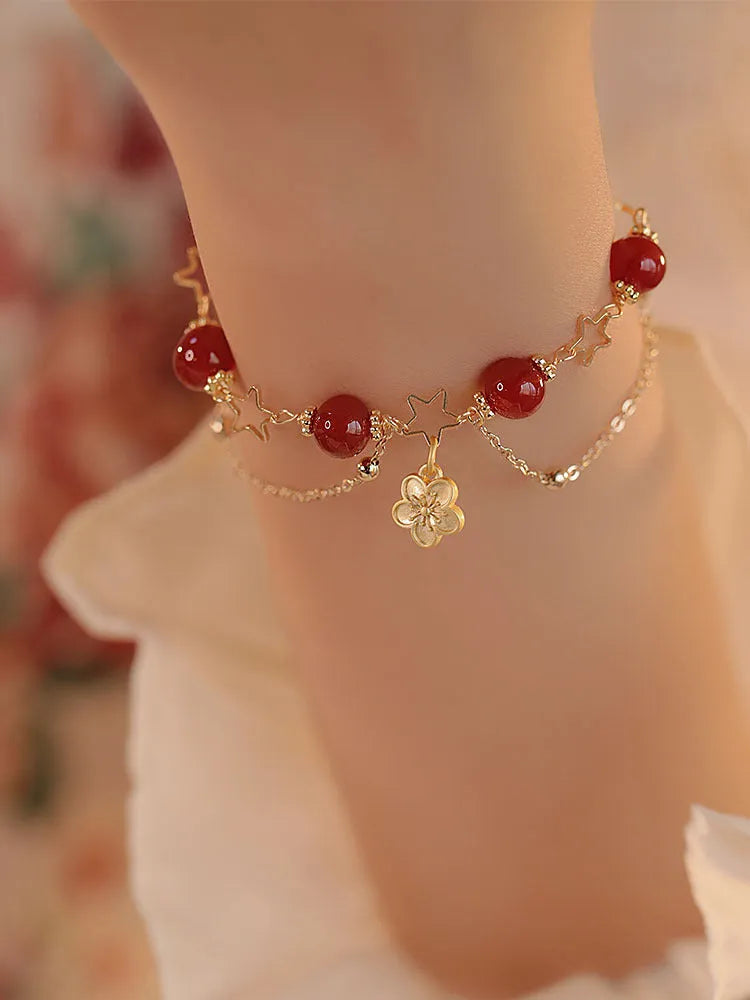 Women's double layer red agate bracelet with peach blossom flower elements and ethnic design