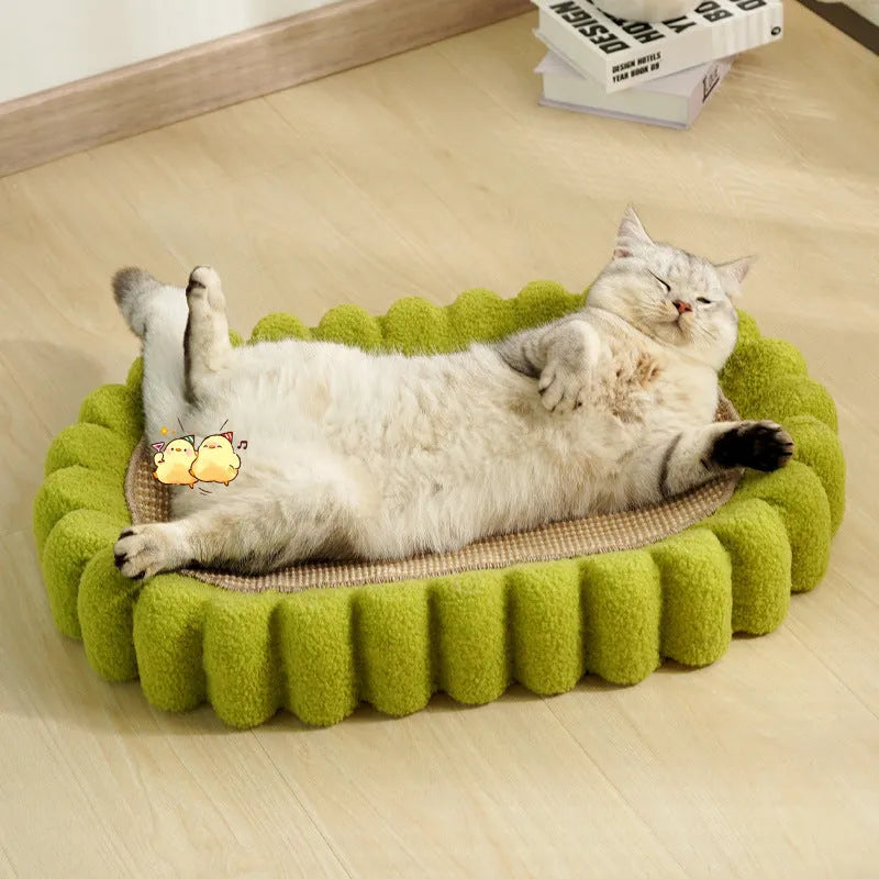 Green oval-shaped cat scratch pad bowl with sisal scratching surface, functioning as a cat bed.