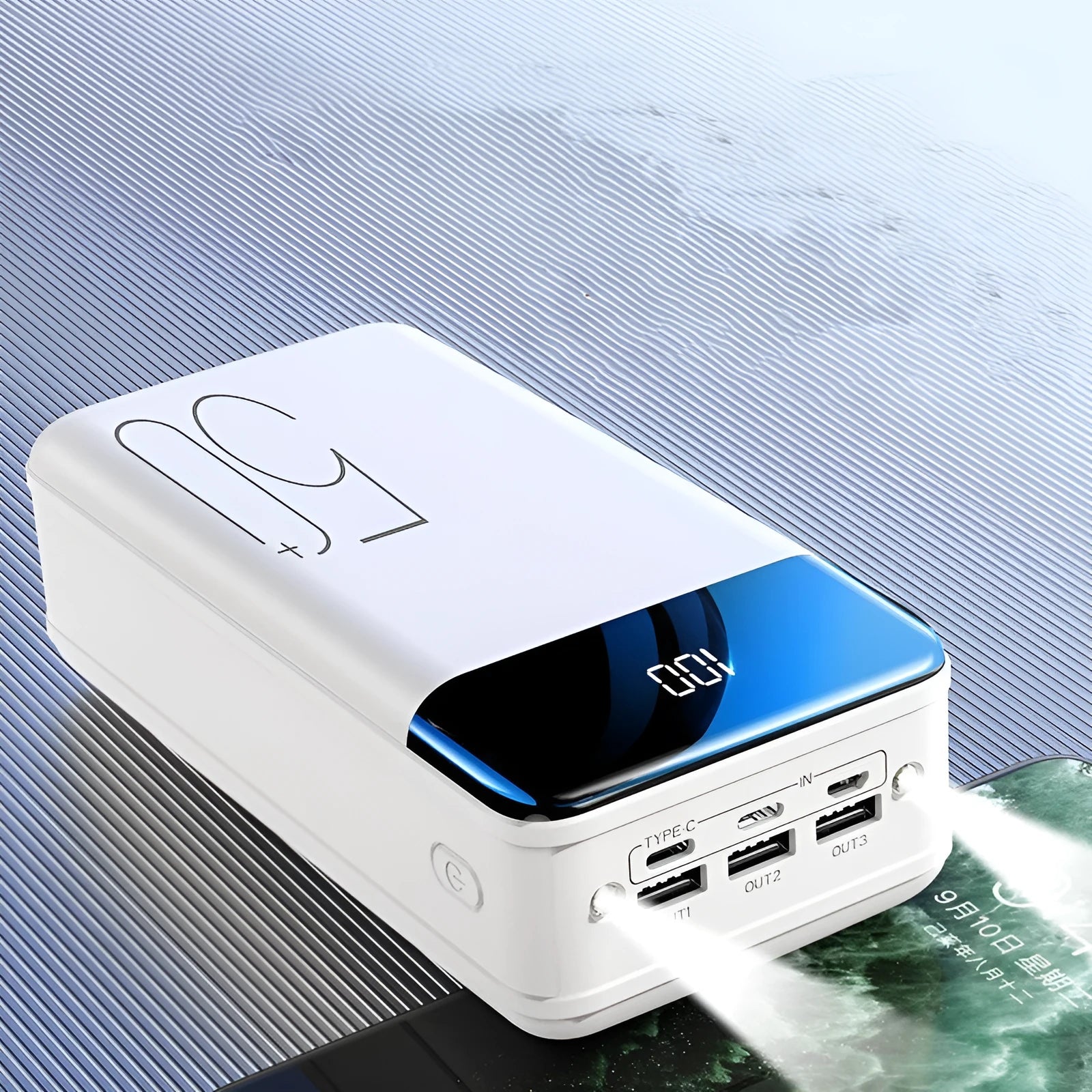 Large capacity 50000mAh power bank with three USB ports in black or white plastic casing