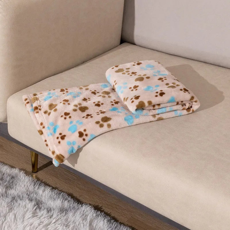 Blue dog cartoon print pet blanket laid flat, showing double-sided flannel texture.