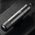 Gun grey aluminium alloy automobile safety hammer with seatbelt cutter, shown with test glass and 3M rubber base.