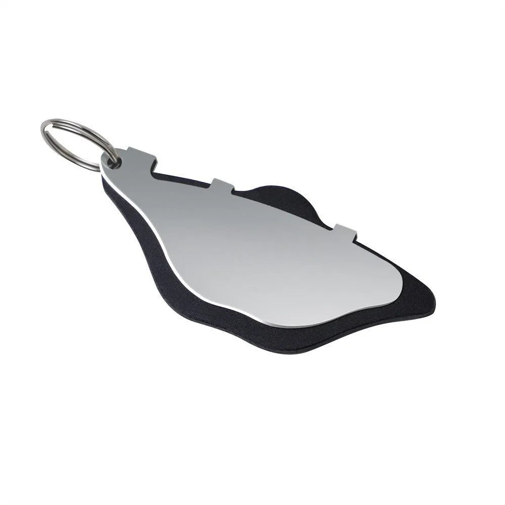 Black and orange metal mountain bike disc brake pads with an adjustment flap.