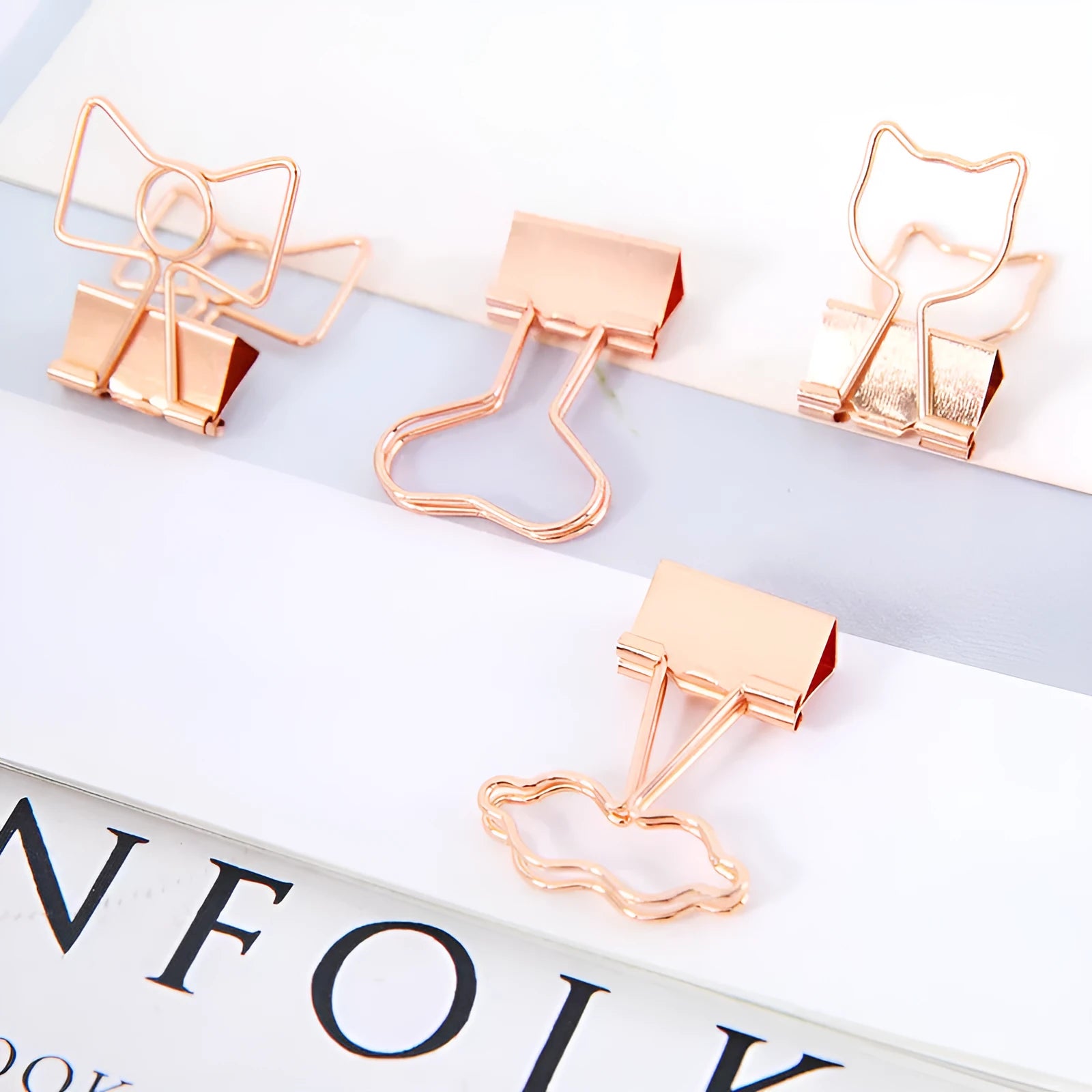 Gold metal paper clip with decorative shape options including bow, cactus, cat, flamingo, love, and clouds.