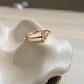 Golden heart-shaped stainless steel ring with electroplated finish shown in sizes 6, 7, and 8