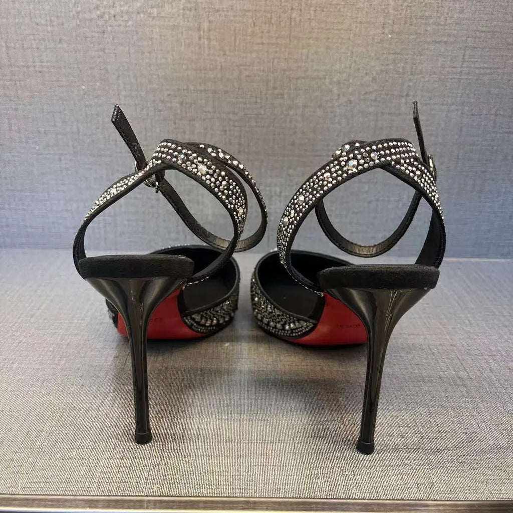 Women's black and silver hollow high heels with red sole and stiletto heel design