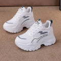 White women's low-top dad shoes with cross shoulder straps and a front lace-up closure.