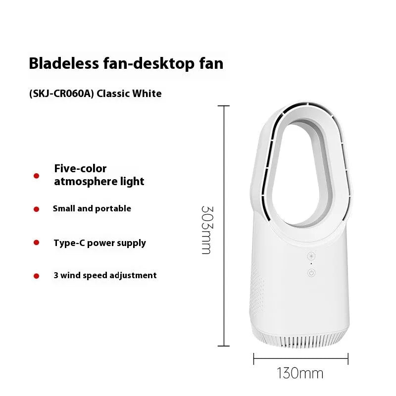 White bladeless tower fan with remote control on a wooden floor next to a desk.
