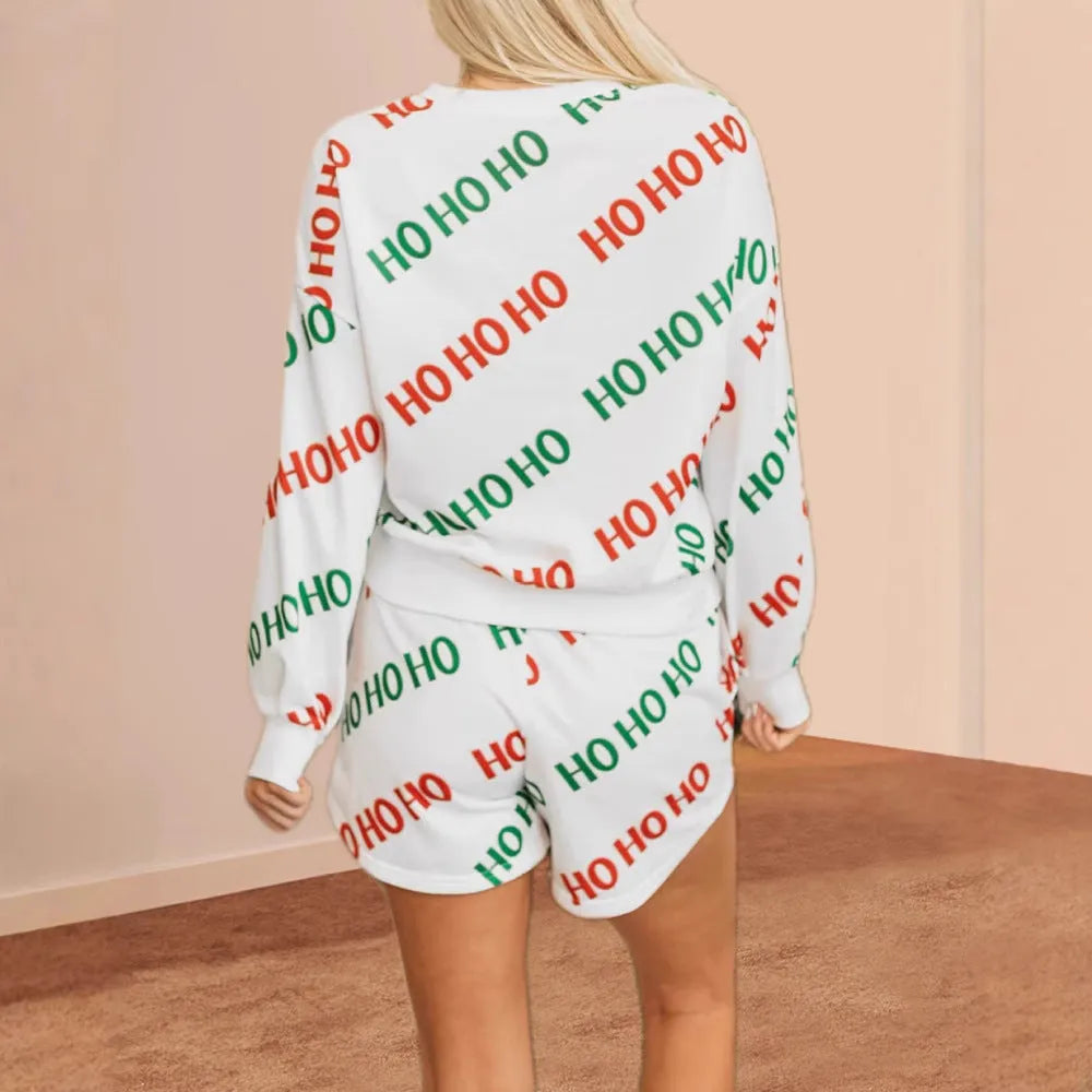 White women's two-piece suit with letters printed design showing long-sleeved top and fifth-length trousers