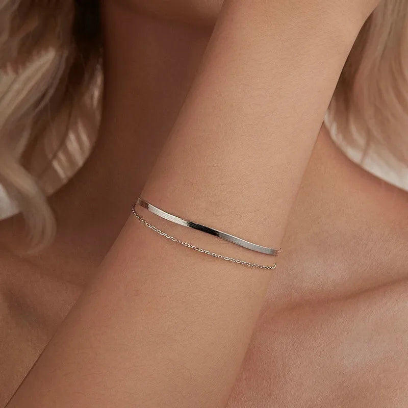 S925 sterling silver double-layer bracelet with electroplated finish, BSB193 colour, on female wrist against neutral background