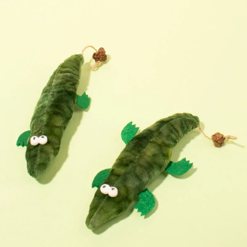 Green plush alligator cat toy with plant-based catnip and peppermint scent for oral cleansing and stress relief