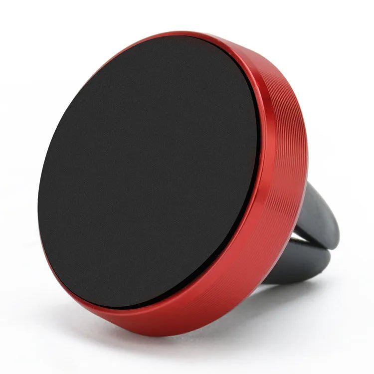 Magnetic car phone holder mounted on air vent with mobile phone attached