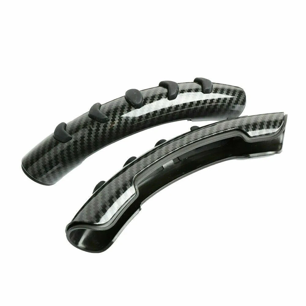 Carbon fibre black fibre anti-skid sleeve on a car steering wheel.