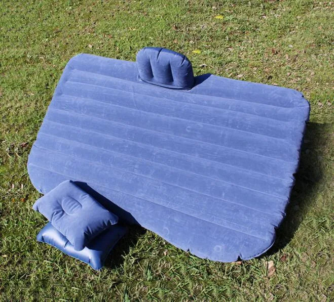 Universal inflatable car bed with flocking material, shown with pump, pillows, and storage bag.