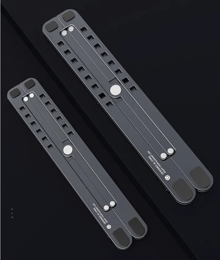 A folded and unfolded aluminium laptop stand in silver, shown next to a laptop.