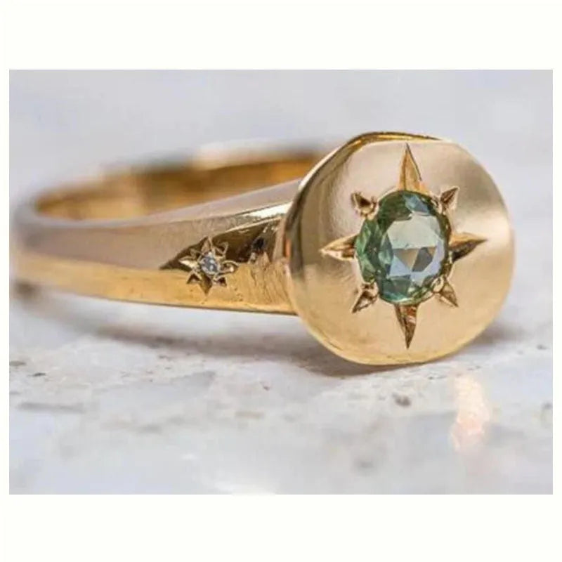 Gold-coloured adjustable ring with a detailed star and oval asterism zircon design.