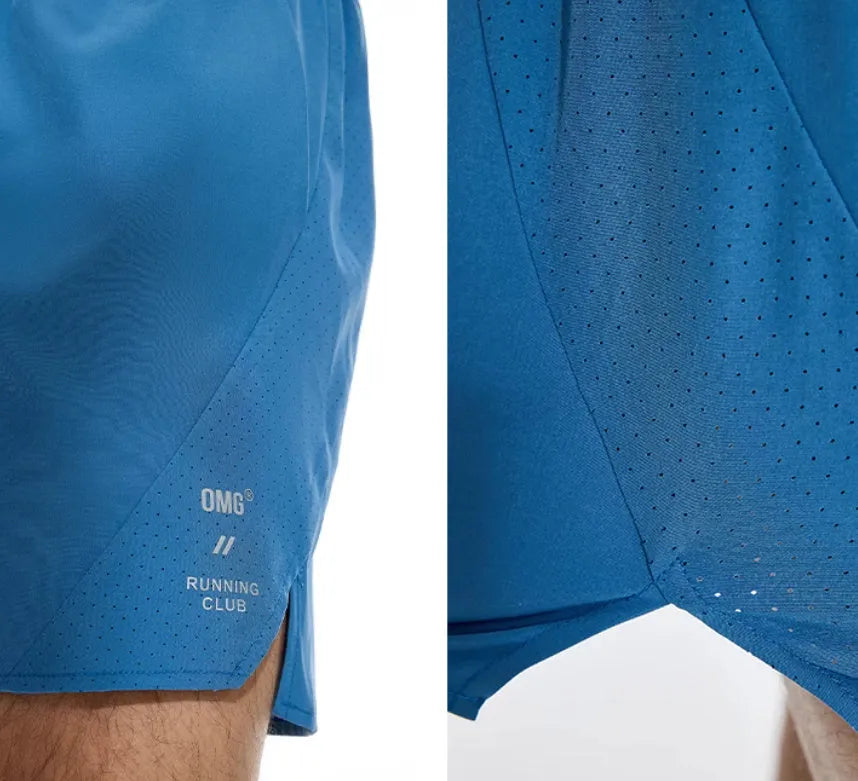 Close-up of black four-point stretch running shorts showing laser stitching detail on spandex fabric.