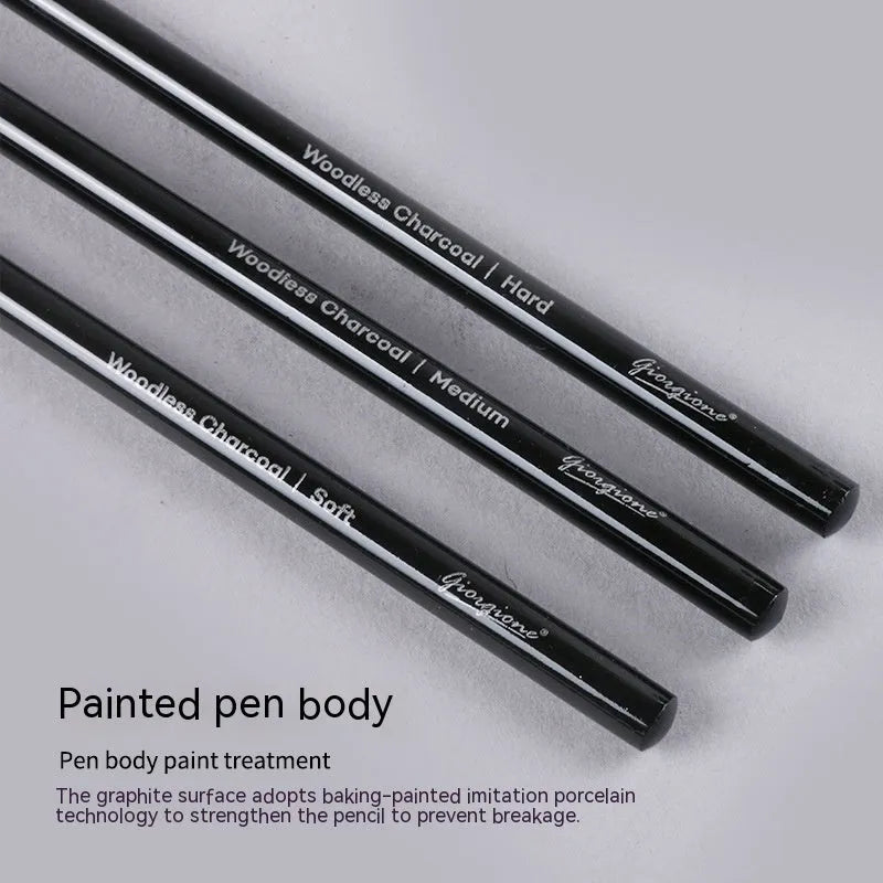 Set of nine wooden artist pencils including graphite and carbonized types on suction card packaging