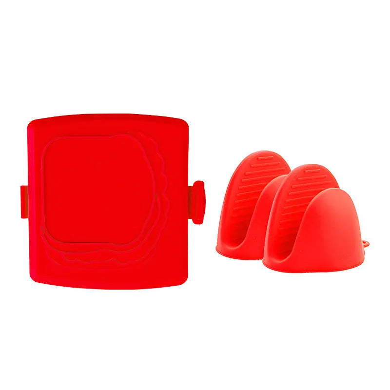 Red silicone baking tray with matching oven gloves set on kitchen counter