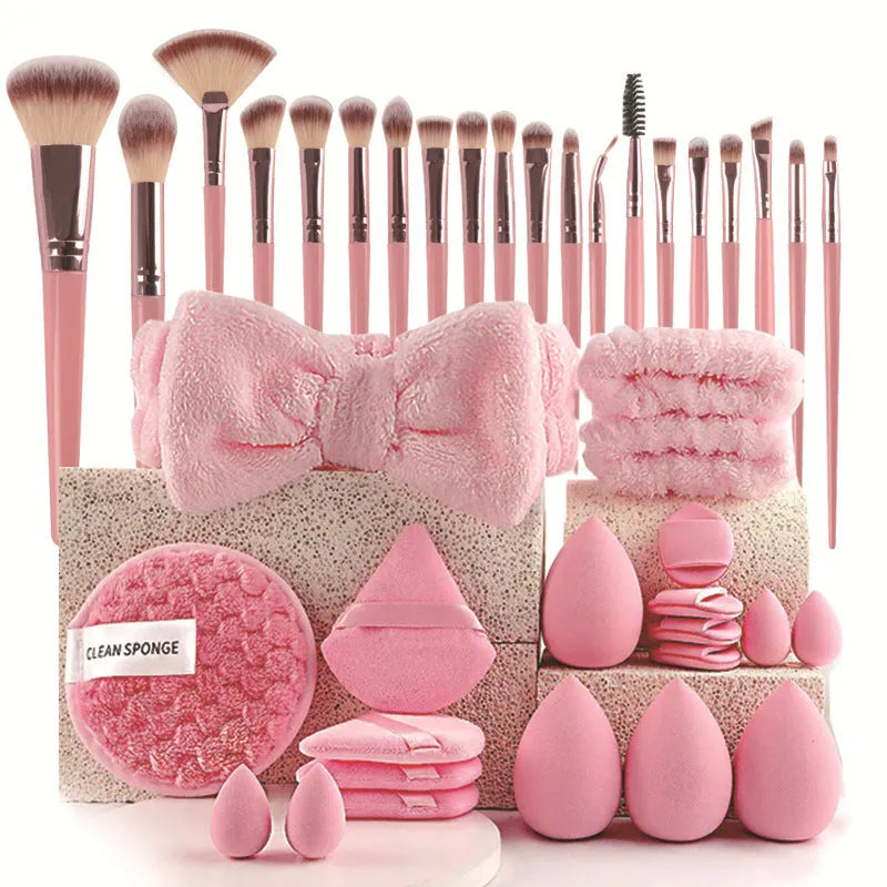 Beauty tool set with multiple pieces in brown, pink and purple colours for face wash and makeup application
