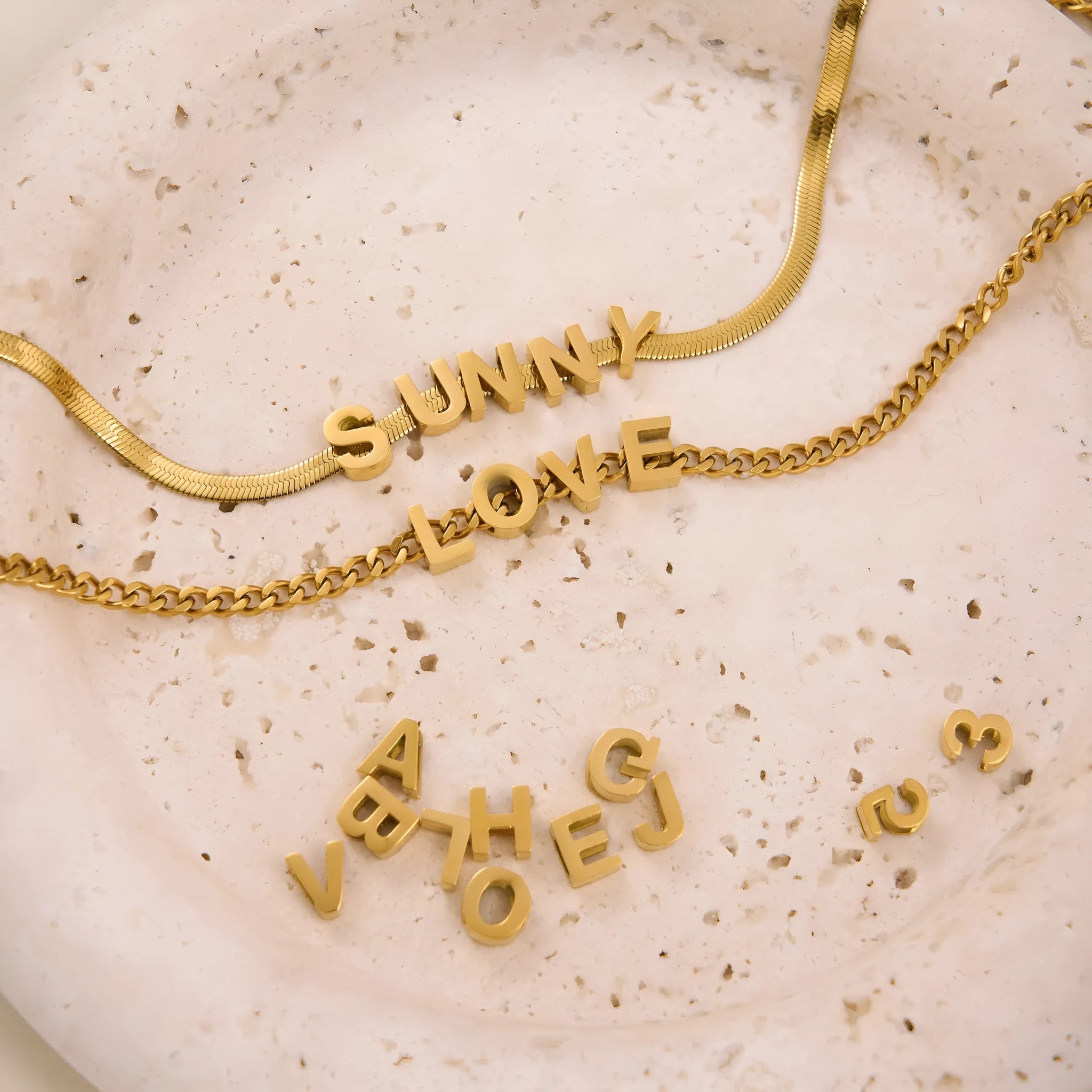 Gold electroplated titanium steel necklace with letter pendant on matching chain