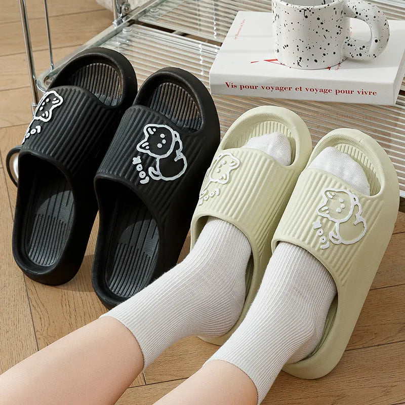 Green EVA foam cat slippers with thick platform sole and anti-slip pattern.