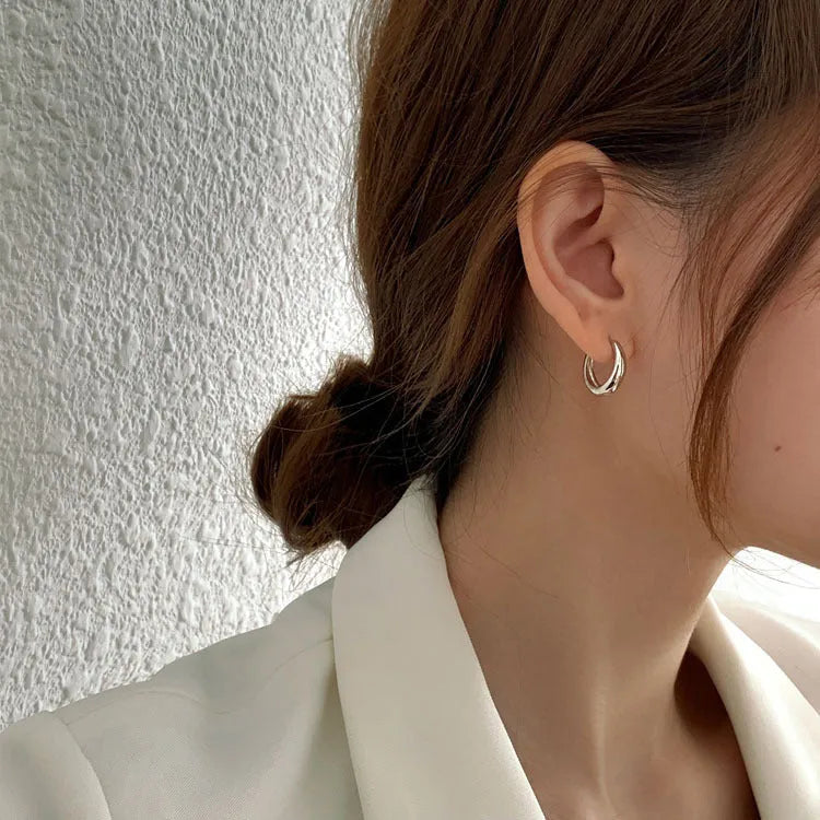 Women's minimalist geometric water drop earrings in gold or silver finish, showing three size variations