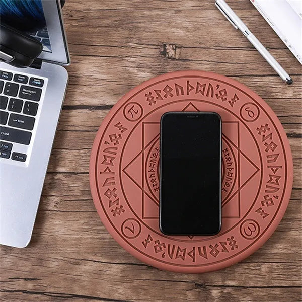 Square wireless charger with glowing magic array pattern design showing phone charging placement