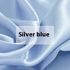Double-sided solid colour silk duvet cover in bright brown laid flat on a bed.
