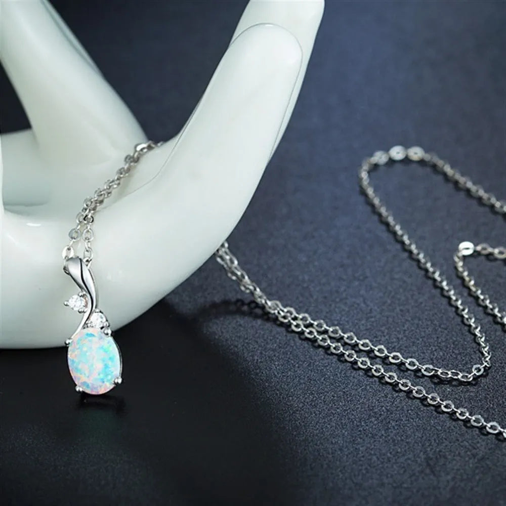 Water drop shaped opal pendant necklace with adjustable O-chain in white gold finish
