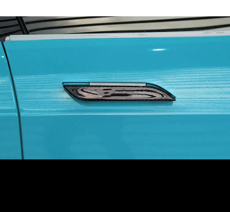Set of four carbon fibre adhesive protection patches for Tesla Model S door handles.